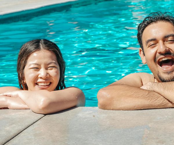 Smiling man looking refreshed and energetic after a workout session, outdoors.